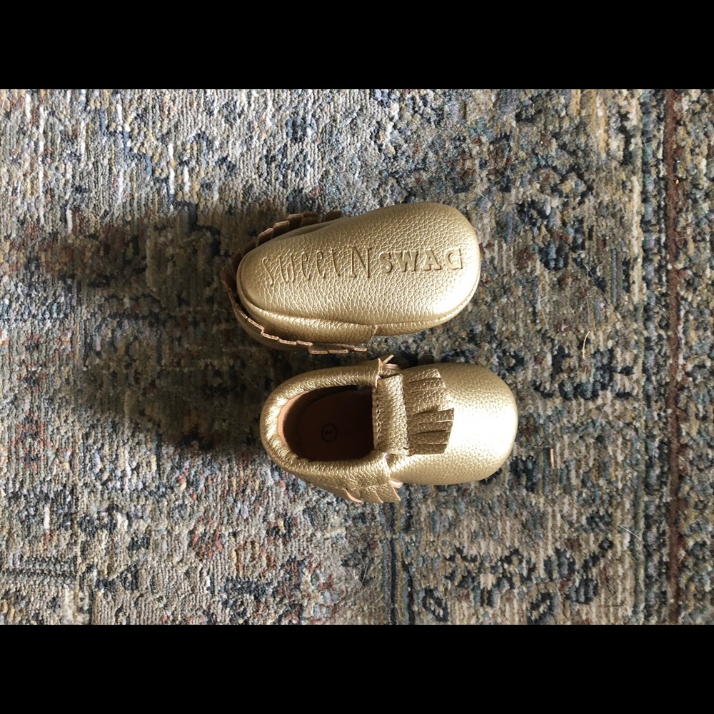 two pairs of baby moccasins